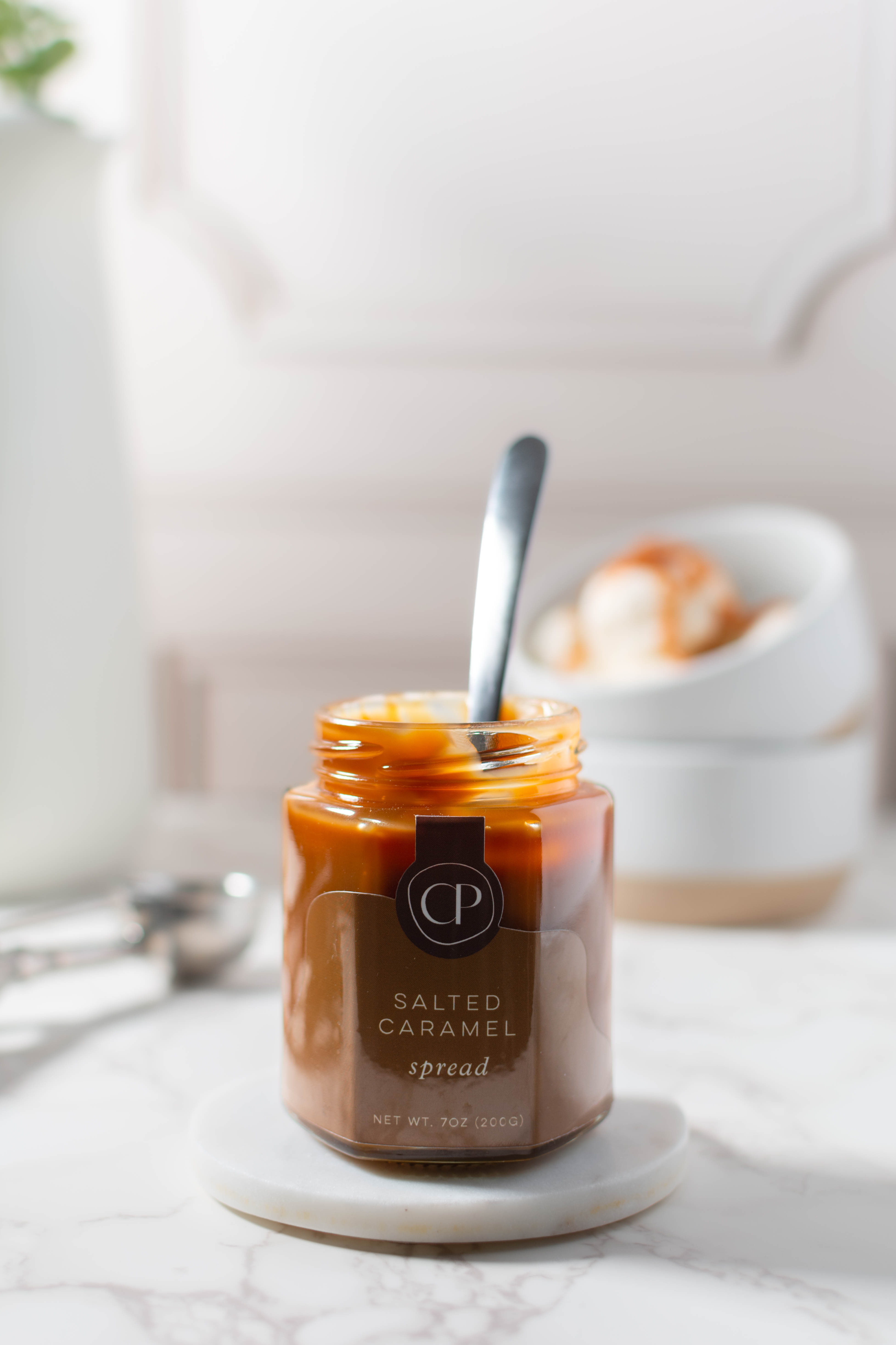 Cocoa Petite's caramel sauce with a spoon in it