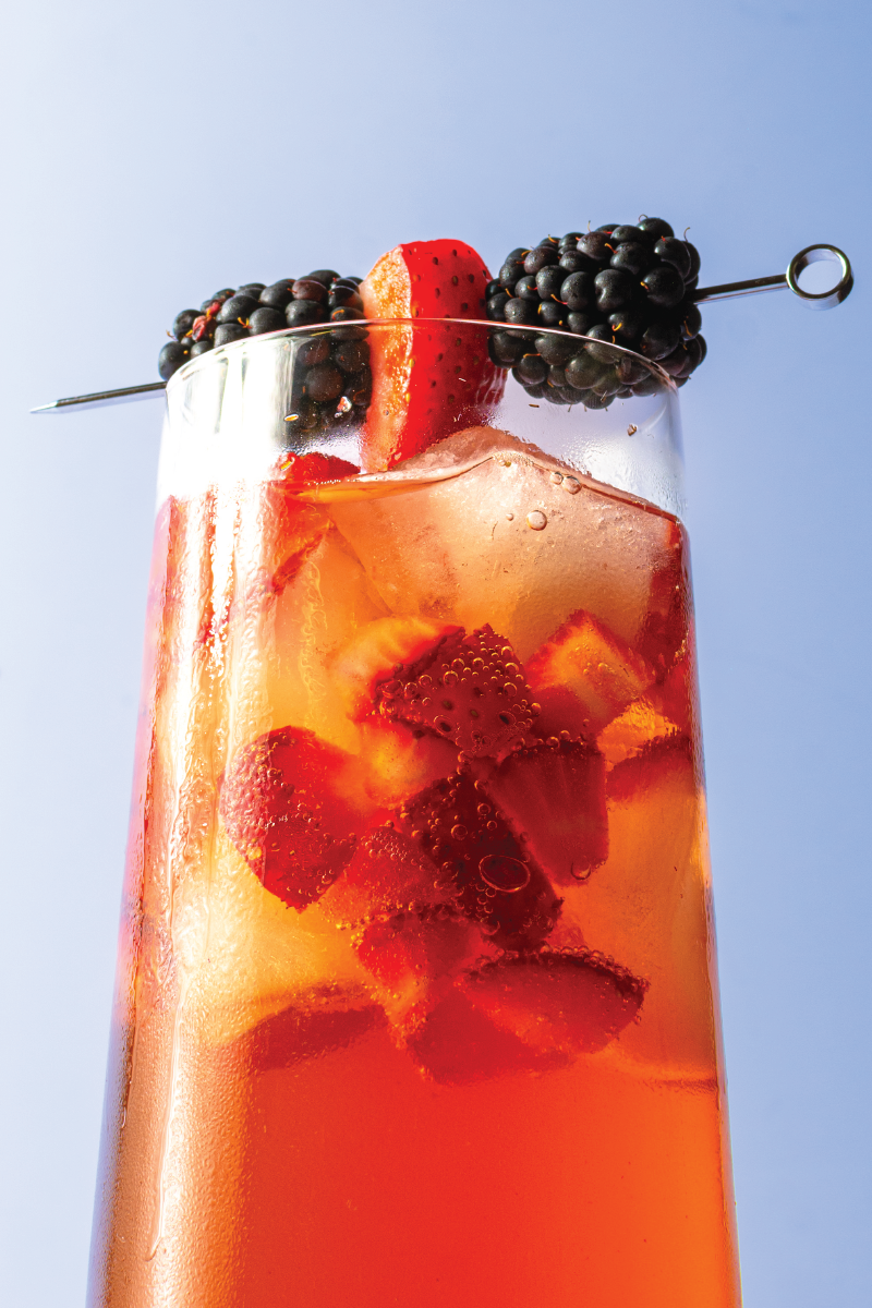 a close up of a fourth of july inspired drink with berries