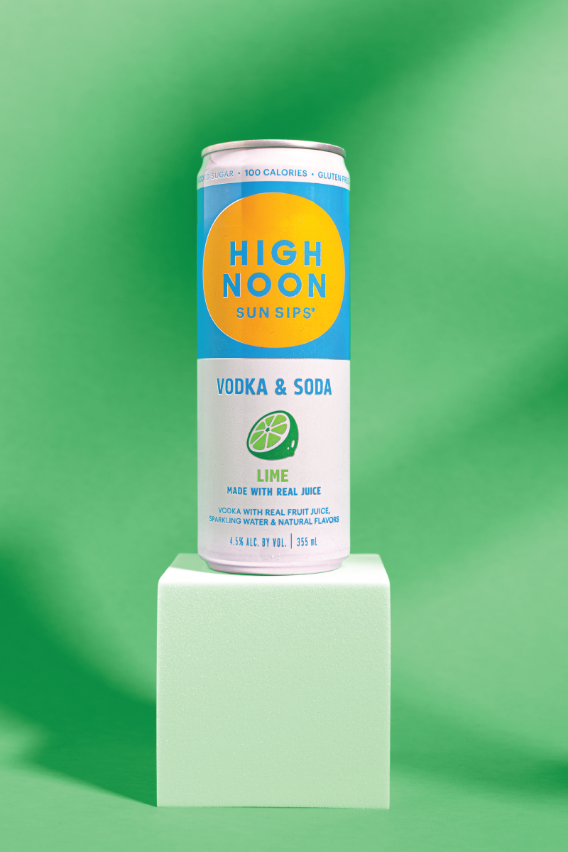 a product photo of a lime flavored high noon against a green background